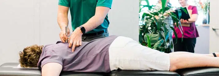 https://www.theshifttc.com/wp-content/uploads/2022/08/Chiropractic-Traverse-City-MI-Back-Pain.jpg.webp